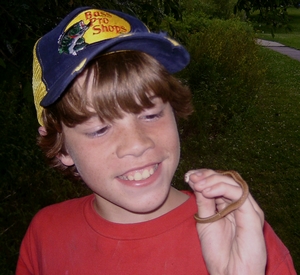 Andrew holding a tiny snake