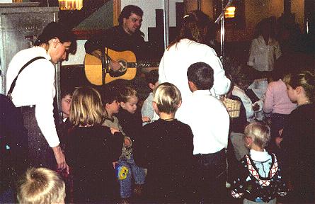 Kirk leading a kids sing-along (the secret resume link is in the guitar -- and Matthew's fun Astounding Products video is hidden in the picture too!)