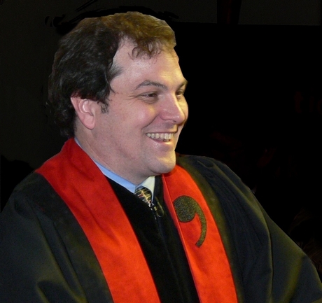 Kirk wearing his cool red comma stole
