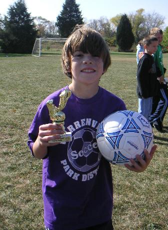 Andrew with soccer awards